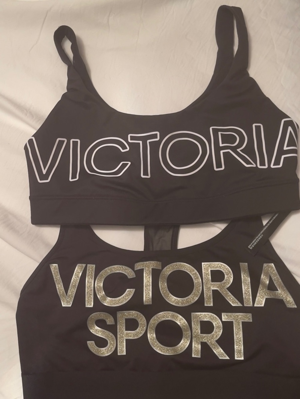 Victoria's Secret Black Sports Bras with White and Gold Logos